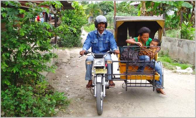 Man making money riding his pedicab taxi